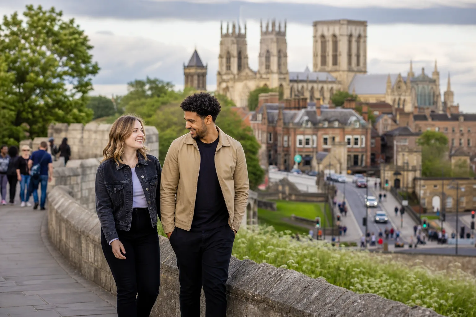 Two people chatting beside the River Ouse in York city centre